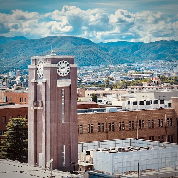A clock tower in the middle of a city